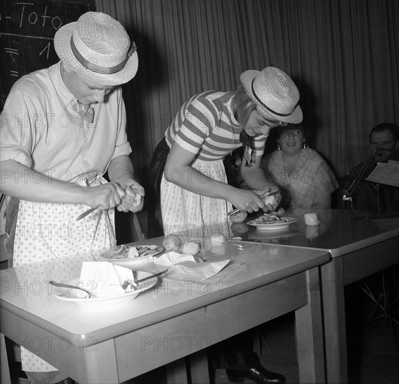 Women peeling and preparing potatoes