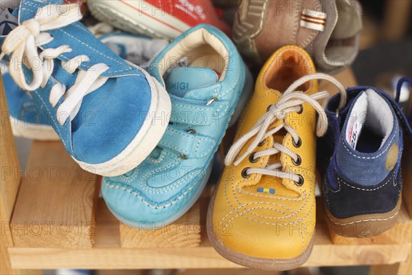 Children's shoes in a shelf