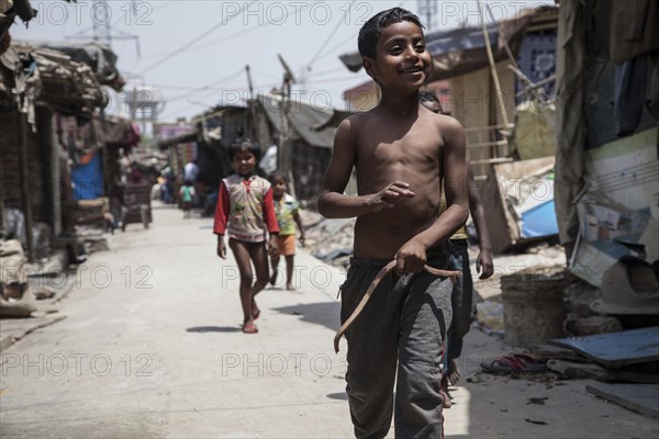 Happy children in the slum at the Ghazipur garbage dump