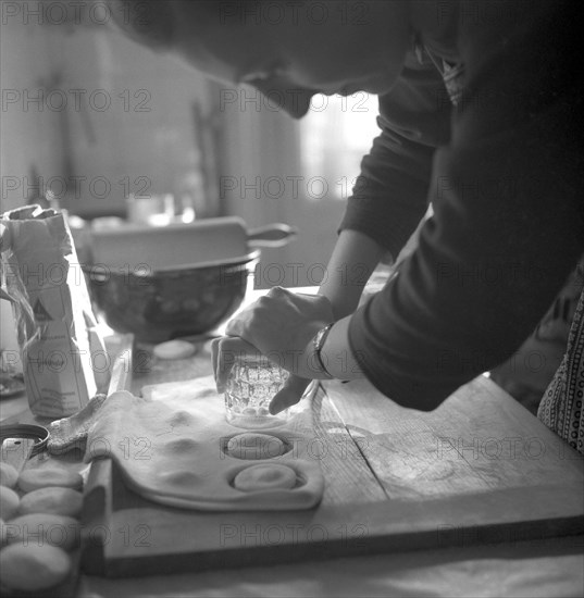 A baker uses a drinking glass as a baking tin