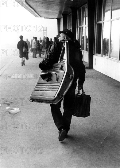 Man with car door ca. 1970s