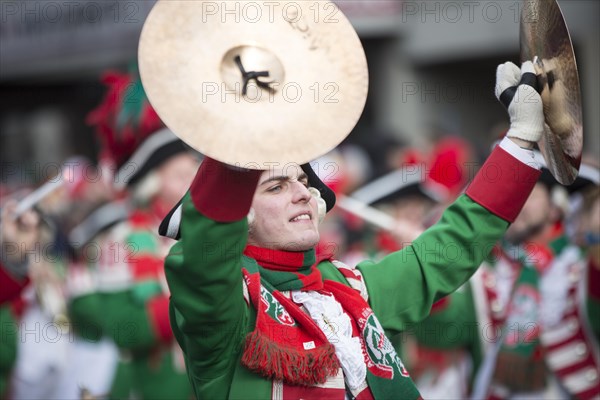 Musician of a brass band with cymbals in uniform