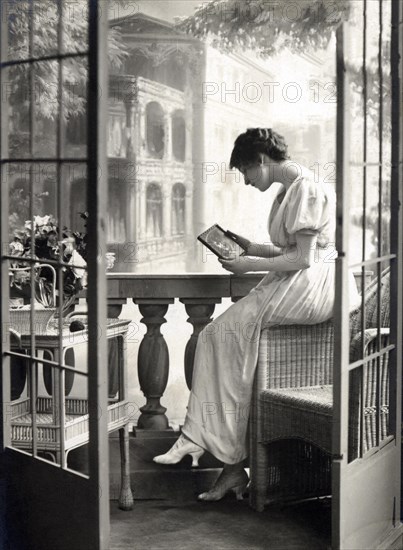 Woman longingly holding a picture of her man