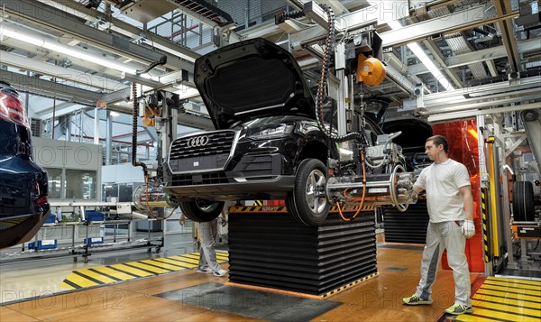 Installation of the wheels on the assembly line for Audi Q2 at the Audi AG plant in Ingolstadt