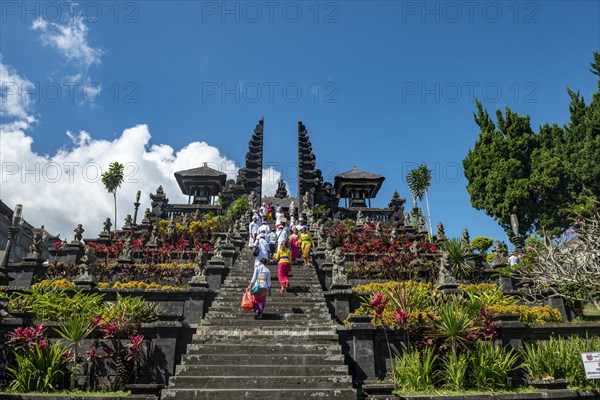 Devout Balinese descend stairs