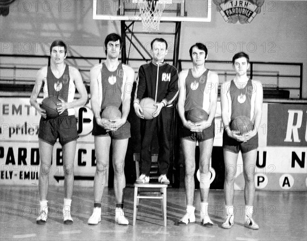 Basketball player with tiny trainer ca. 1970s