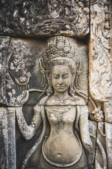 Stone relief of a divine dancer