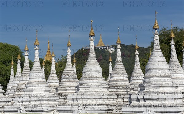 Row of white stupas at Sandamuni Pagoda