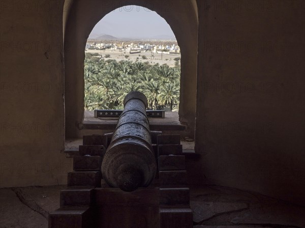 Arched window and cannon