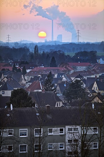 Housing estate with the Gersteinwerk power plant at sunset