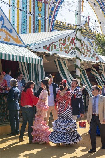 Spanish women with colorful flamenco dresses