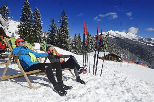 Olympic silver medal winner Tobi Angerer with his wife Romy in a deck chair on the Wildalm