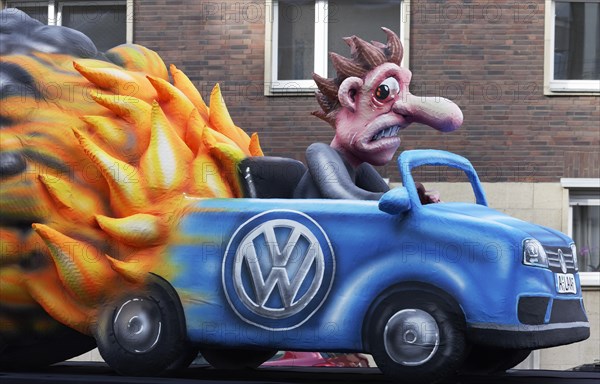 Burning VW car with monkey in exhaust gas cloud