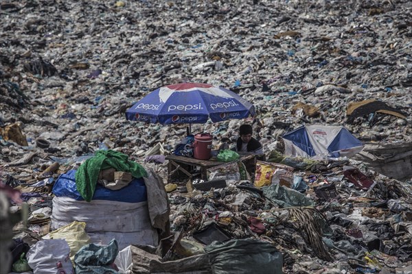 Garbage collectors on rubbish dump on the outskirts