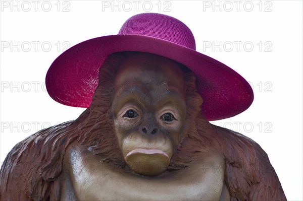 Orang Utan figure with purple sunhat