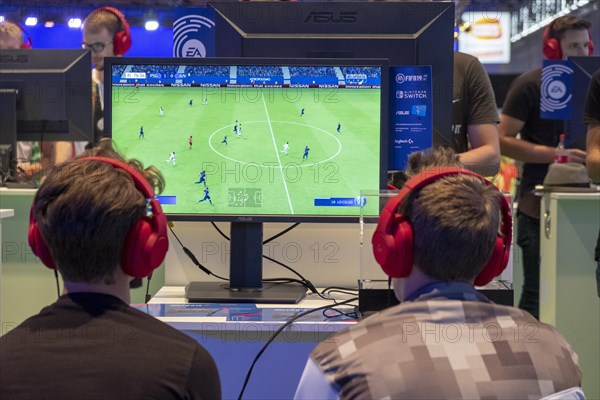 Visitors play football video game