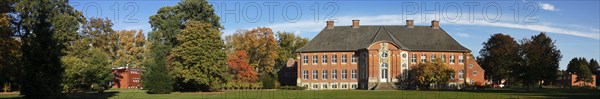 Manor house Borstel Castle with castle park in autumn