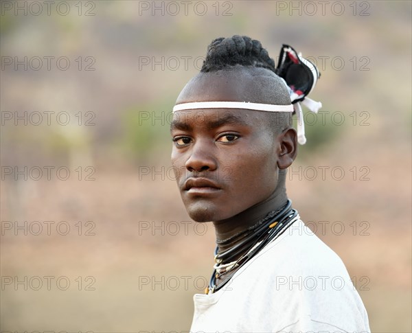 Young Himba man with traditional hairstyle