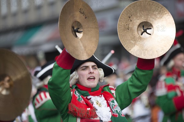 Musician of a brass band with cymbals in uniform