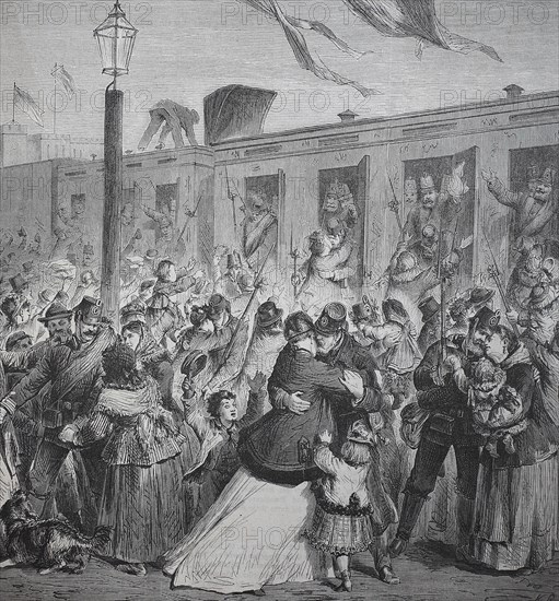 The soldiers of the Guard Landwehr are received by their families at the Potsdam station of Berlin