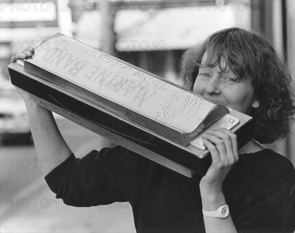 Woman with large harmonica