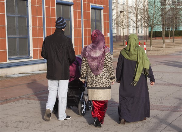 Muslim family with pram