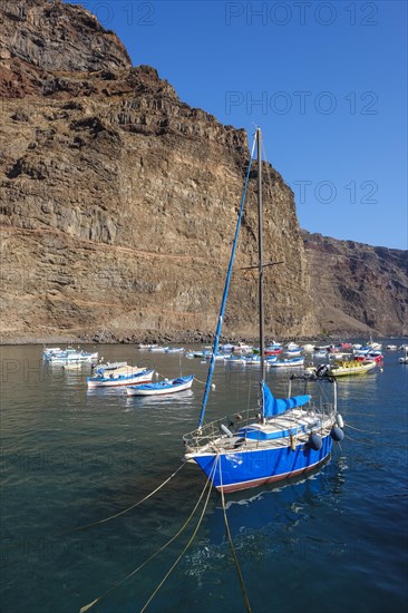 Fishing boats and sailing boat in the port