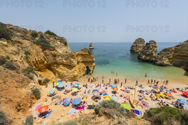 Tourists and bathers at the sandy beach