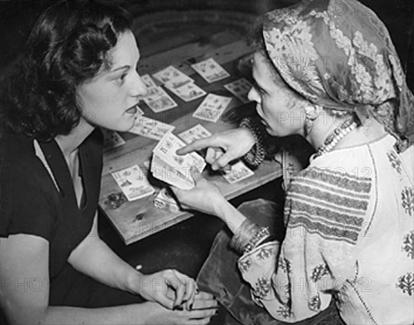 Fortune teller with tarot cards and glass ball