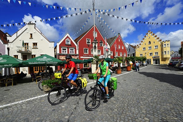 Cyclists in the old town of Abensberg