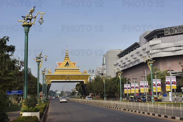 Thai style city gate next to modern Central Plaza shopping centre