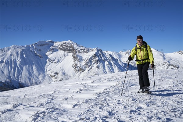 Obernberger Tribulaun in winter with snowshoe hiker