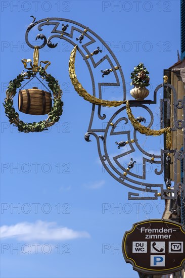 Hanging shop sign with a beer barrel