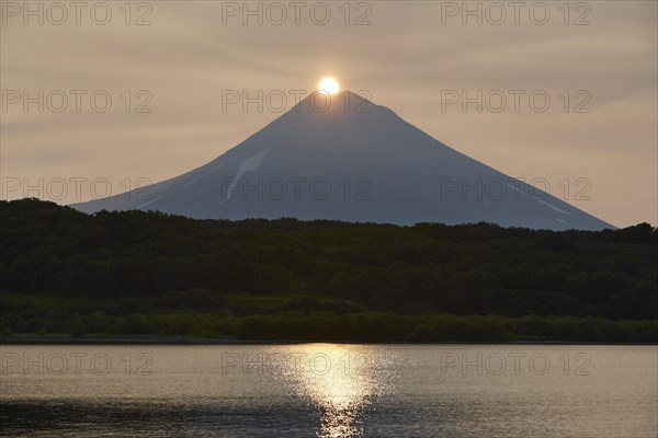 Sunrise over the summit of the Ilyinsky volcano at the Kurilskoye lake