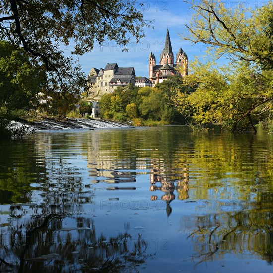 Limburg Cathedral St. Georg or Georgsdom and imburg castle over the river Lahn in autumn