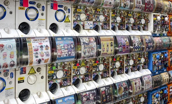 Gachapon machines with toys in small capsules on the electronics mile Akihabara