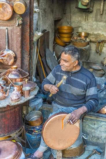 Coppersmith at work