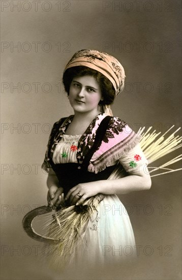 Woman with sickle and straw