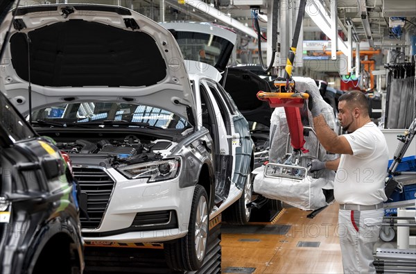 Installation of the front seats on the assembly line of the Audi A3 at the Audi AG plant in Ingolstadt