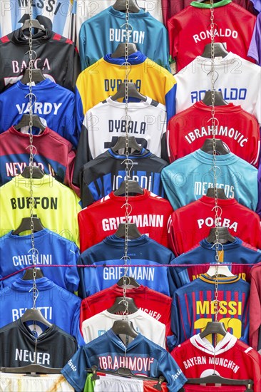 Football jerseys with names of football players for sale at sales stall