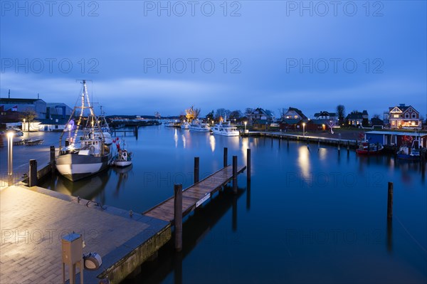Baltic Sea harbour with boats at dusk