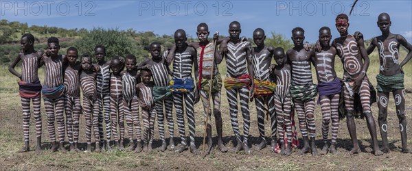 Group picture of boys and young men with typical body paintings