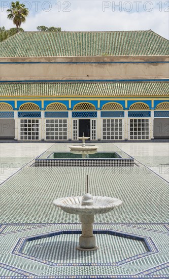 Ornate courtyard with columns and fountain