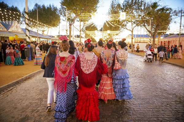 Spanish women with colorful flamenco dresses