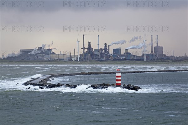 Industrial area and lighthouse in the harbour entrance