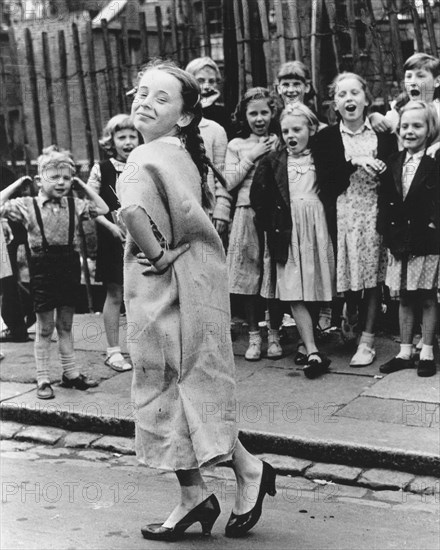 Girl dancing with sackcloth as dress