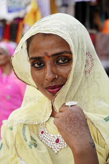 Indian woman with yellow scarf