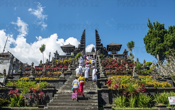 Devout Balinese descend stairs