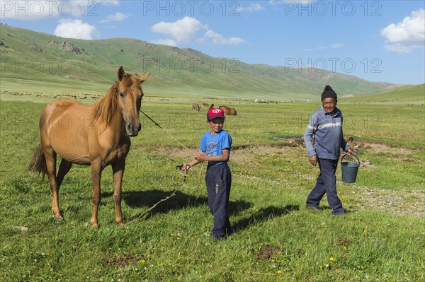 Kyrgyz boy with his horse