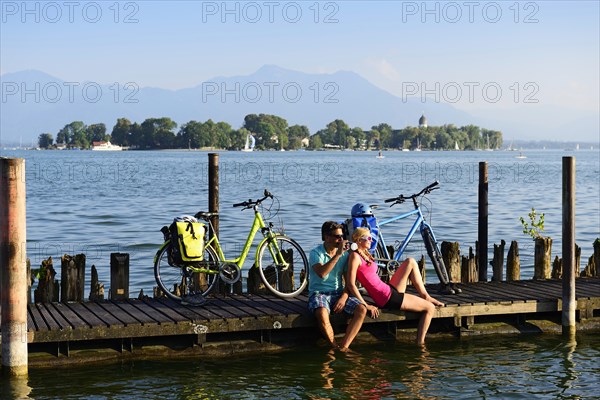 Cyclists resting on jetty